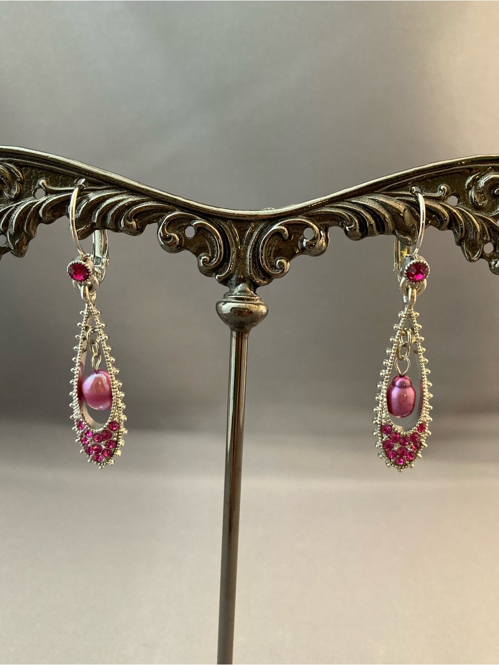 Silver tone metal pink purple hanging crystal earrings